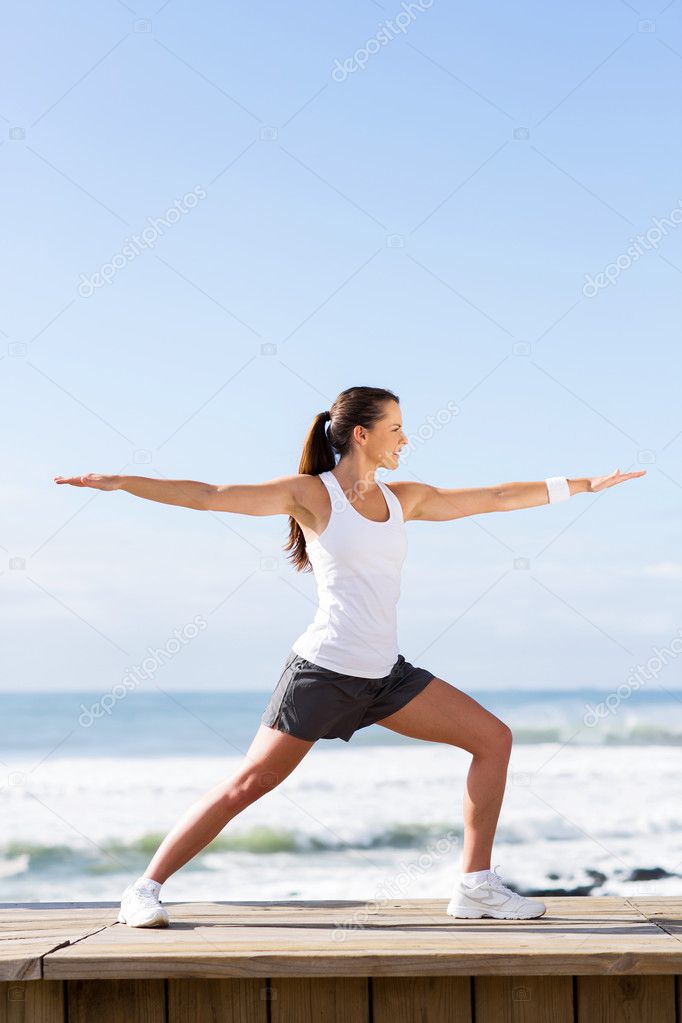 woman doing yoga warrior pose