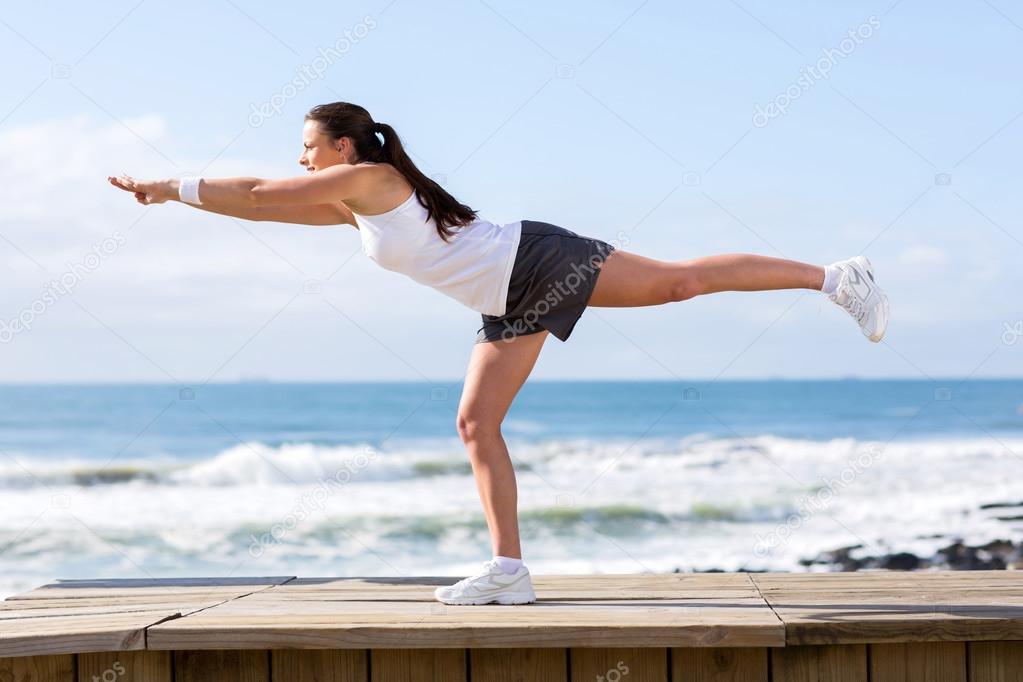 young woman doing yoga stretch