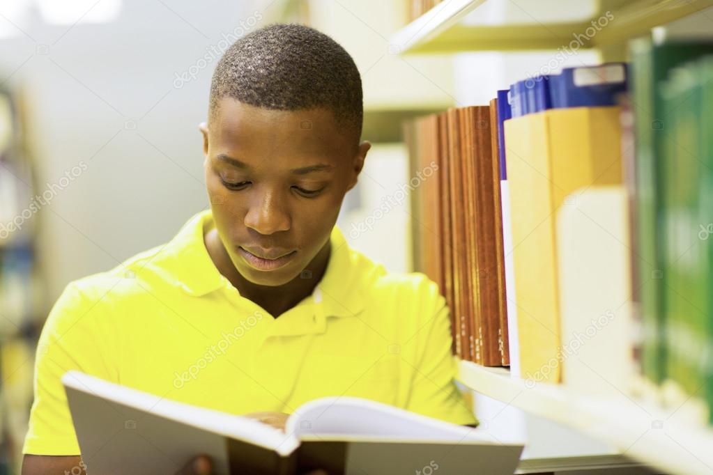 African man reading book