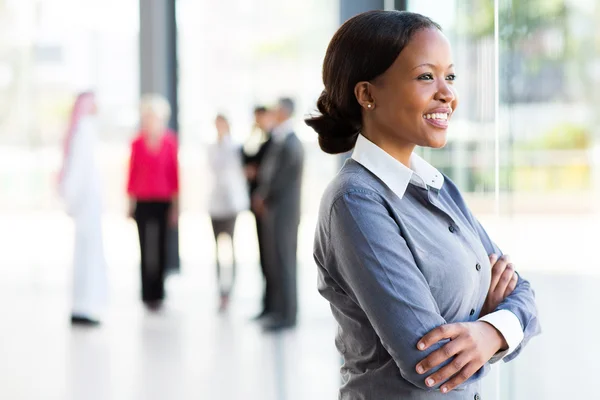 Businesswoman looking outside window — Stock Photo, Image