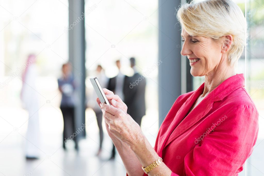 Businesswoman reading email on smartphone