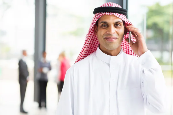 Arabian businessman talking on cell phone — Stock Photo, Image