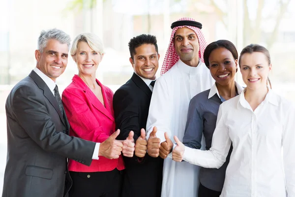 Business team giving thumbs up — Stock Photo, Image