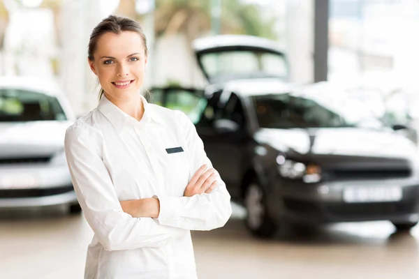 Sales consultant in car showroom — Stock Photo, Image