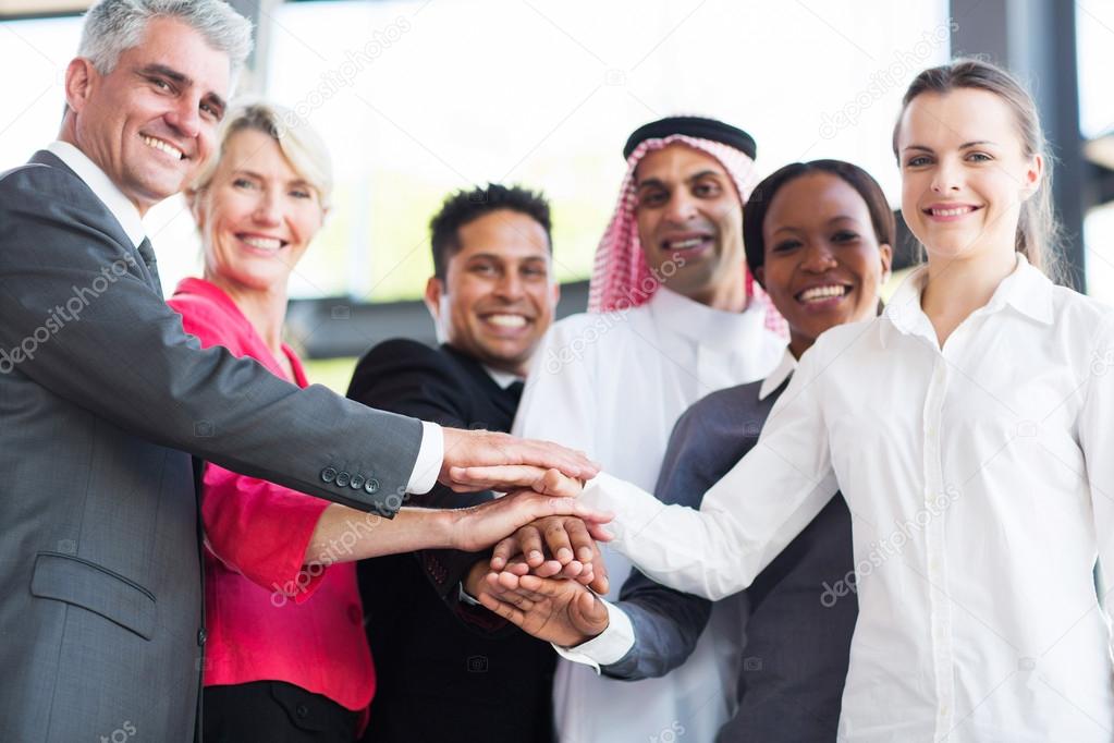 Multiracial business team hands together