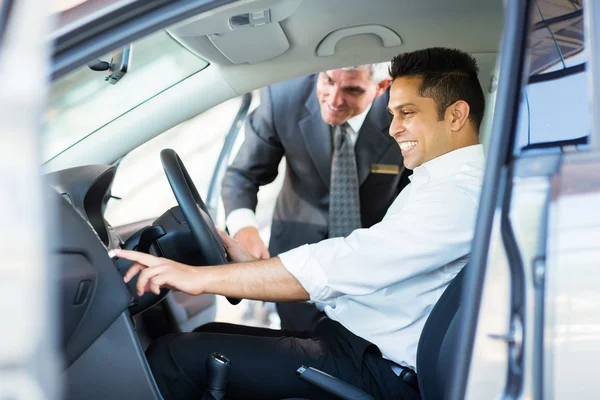 Indian man checking car features — Stock Photo, Image