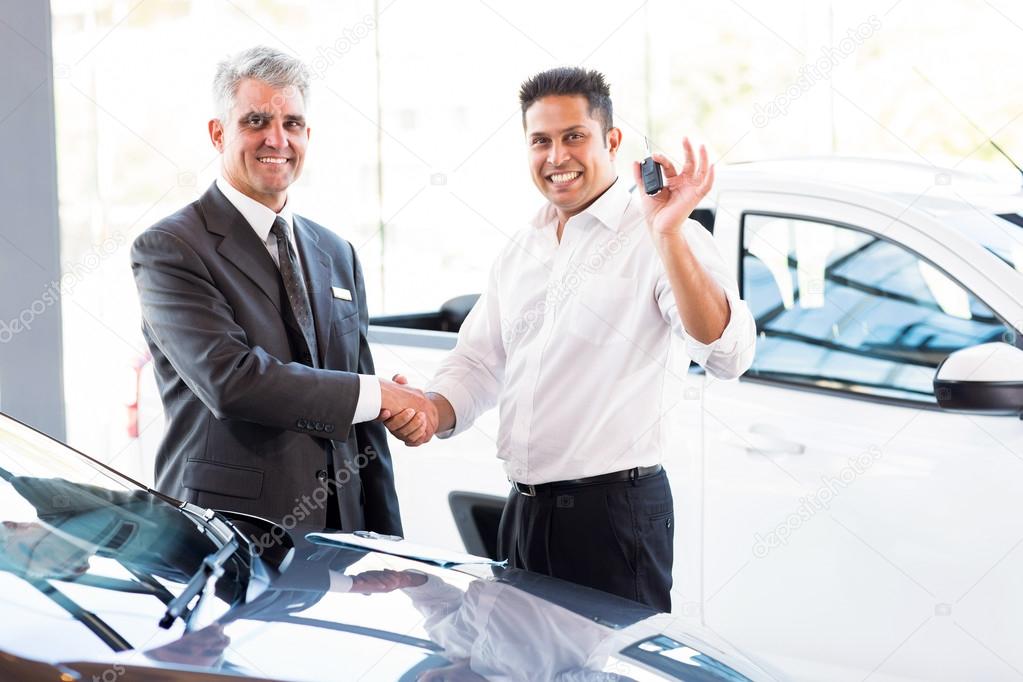 Indian man handshaking with salesman