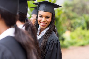 African graduate looking back clipart