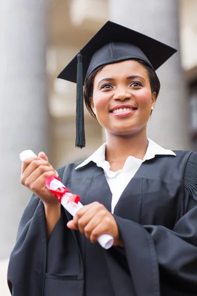 African female graduate holding diploma — Stock Photo, Image