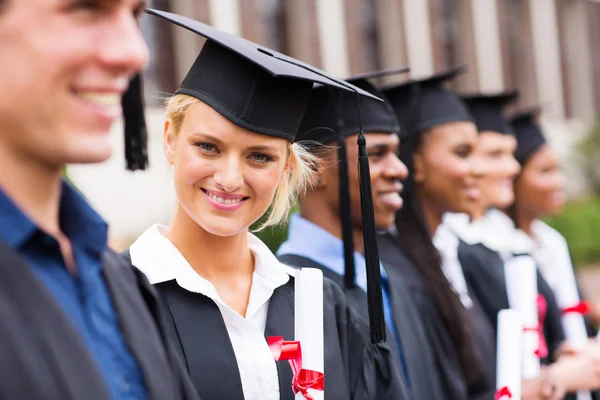 Pretty university student in graduation attire Stock Image