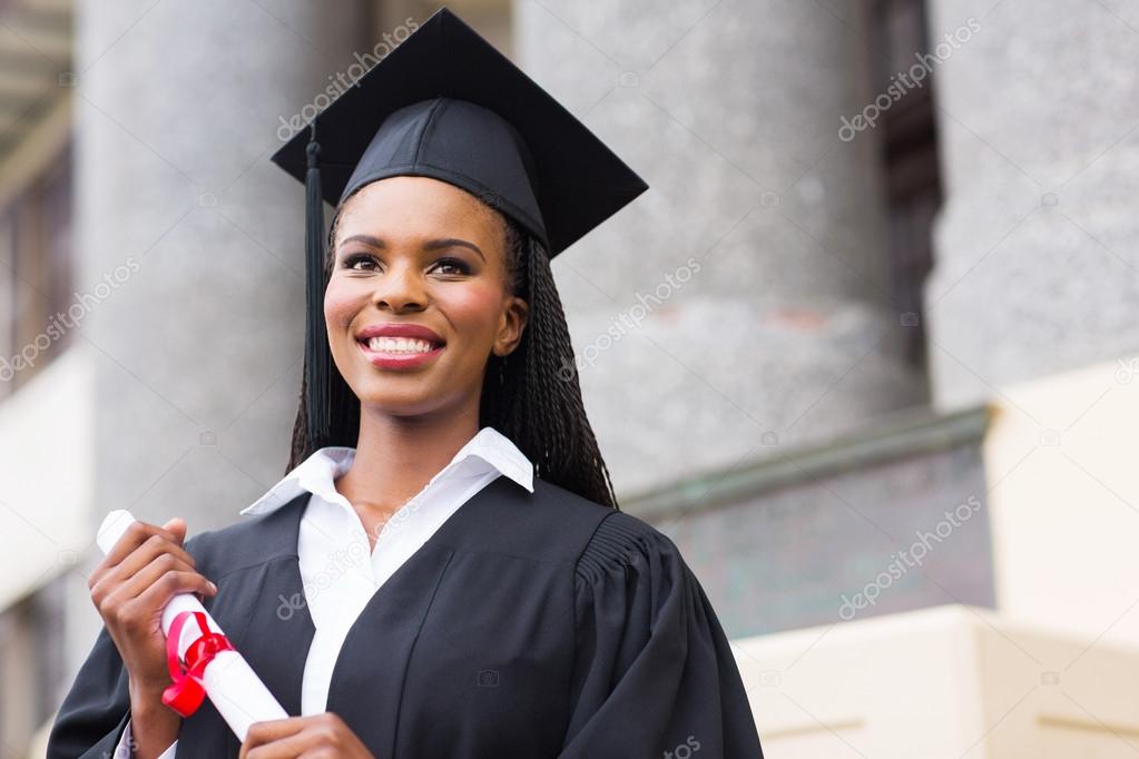 Female graduate with diploma outside college