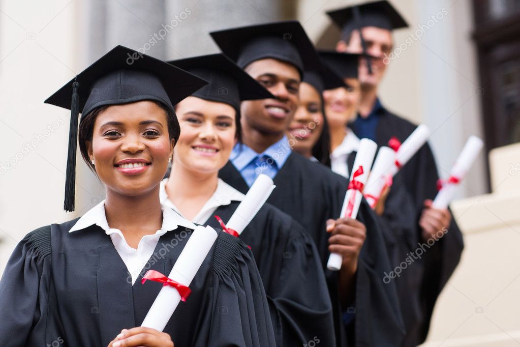 Smiling university graduates at graduation