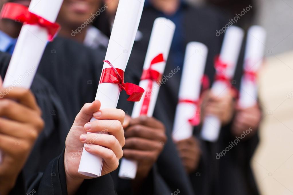 Graduates holding diploma