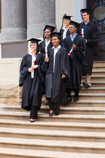 Graduates walking down the stairs — Stock Photo, Image