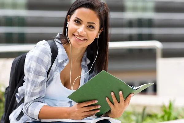 Female university student listening music — Stock Photo, Image