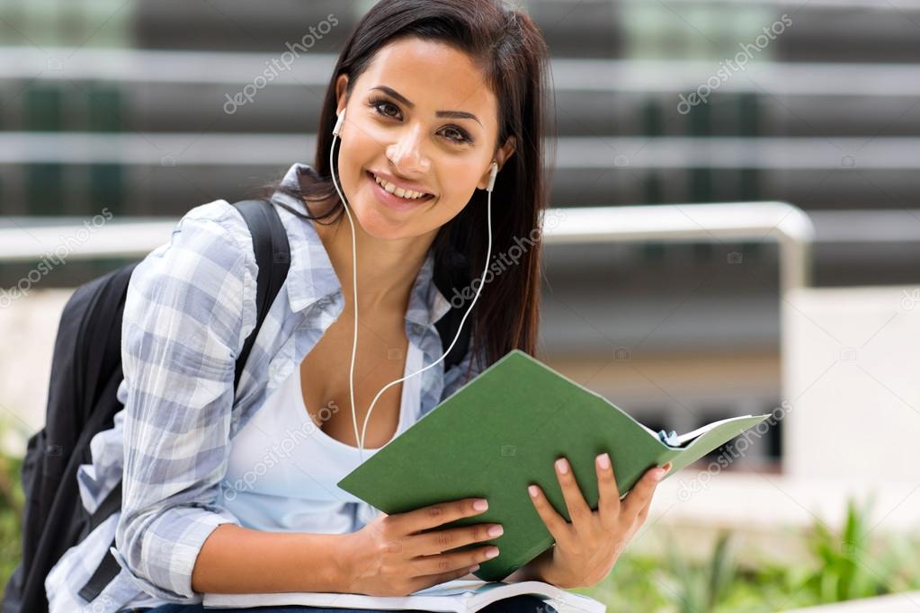 female university student listening music 