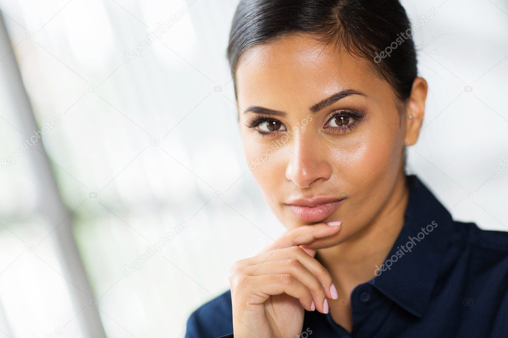 Businesswoman with hand on face