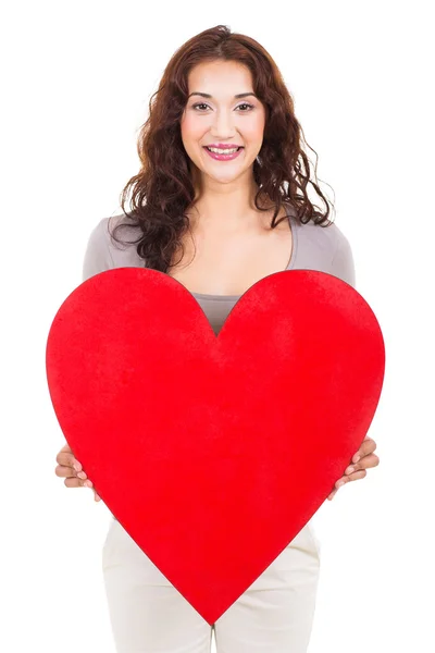Pretty girl holding heart shape — Stock Photo, Image