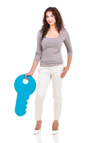 Young girl with a large key symbol — Stock Photo, Image