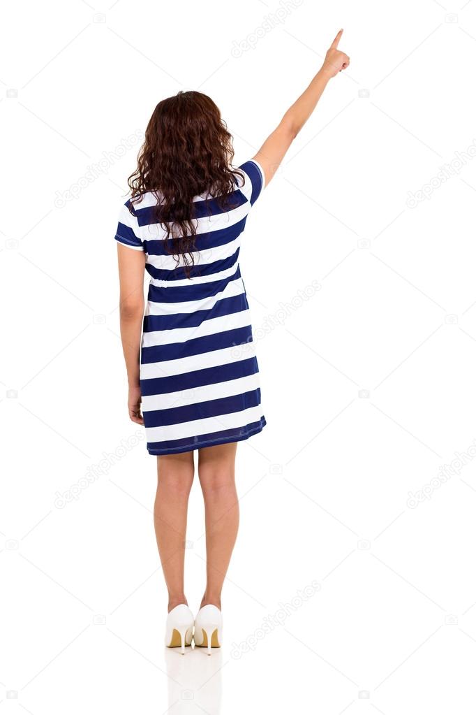 back view of young woman pointing up