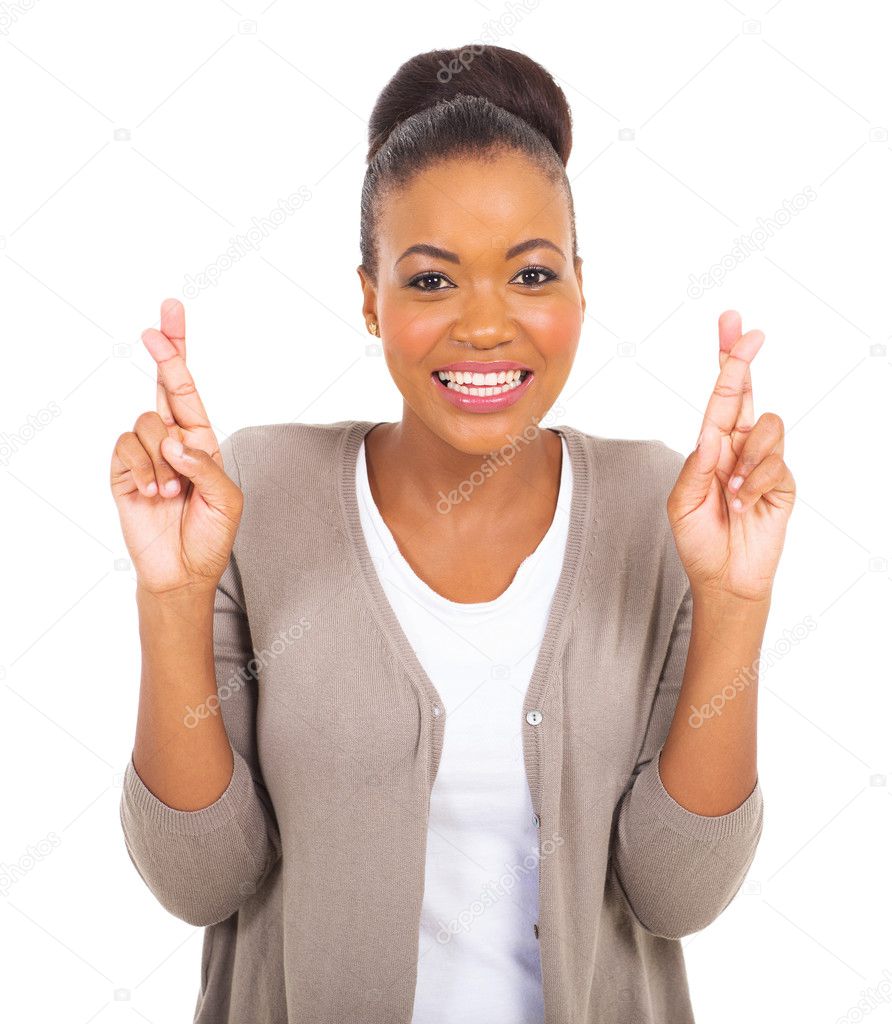 African woman with fingers crossed