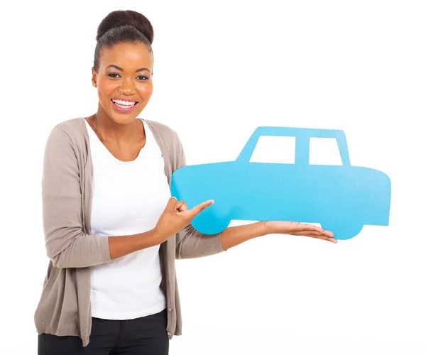 Kobieta wskazując samochód symbol — Zdjęcie stockowe