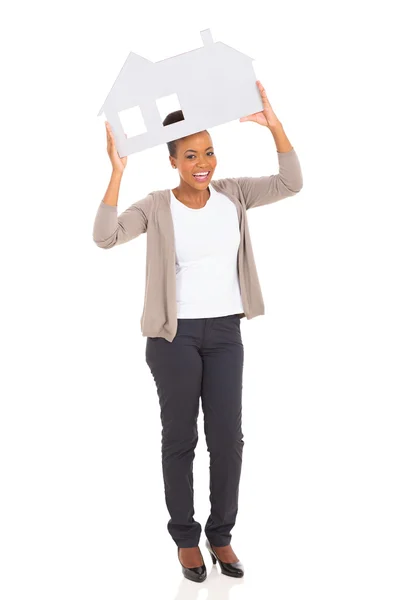 Afrikaanse vrouw weergegeven: huis symbool — Stockfoto