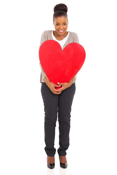 Young woman holding heart shape — Stock Photo, Image