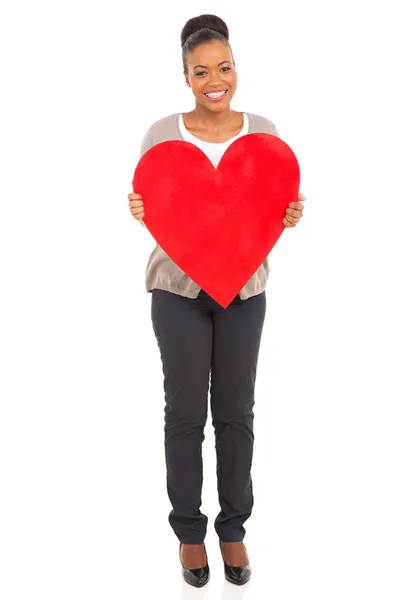 Young african american woman holding heart shape — Stock Photo, Image