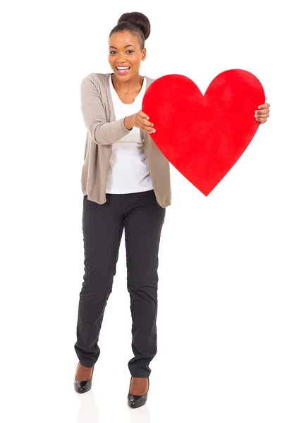 Pretty african woman presenting heart shape — Stock Photo, Image