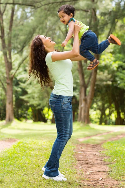 Young indian mother playing with baby boy — Stock Photo, Image