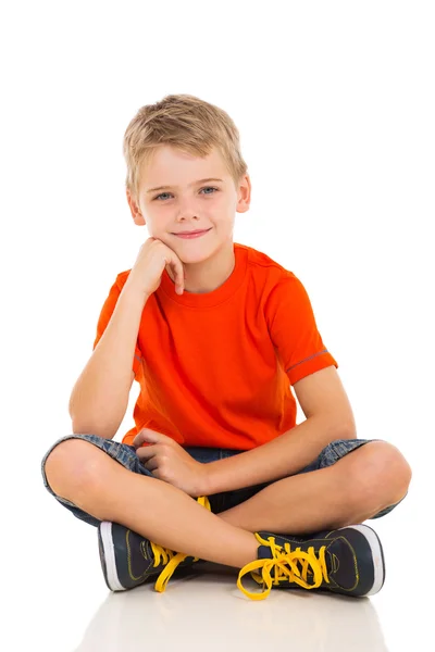Boy sitting on white background — Stock Photo, Image
