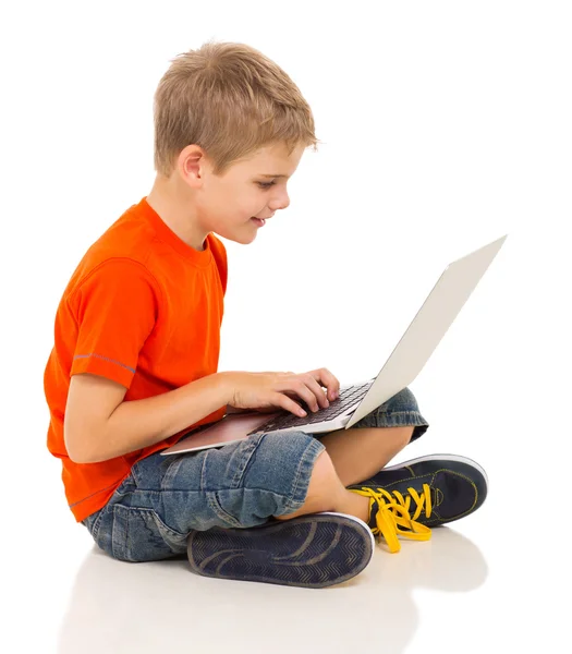 Cute boy using laptop computer — Stock Photo, Image