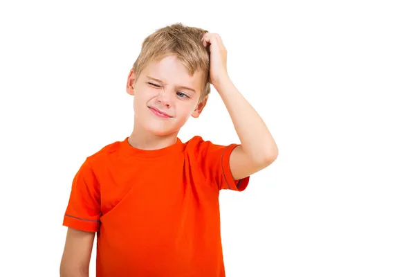 Young boy scratching his head — Stock Photo, Image