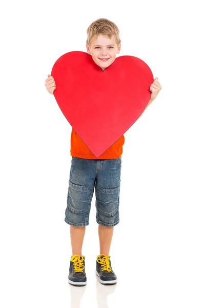 Little boy showing red heart symbol Stock Photo