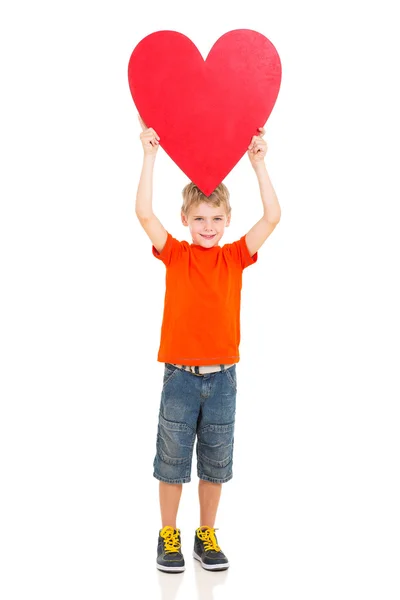 Boy holding up red heart shape Stock Image