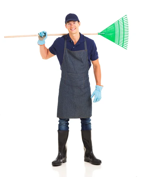 Gardener carrying a rake — Stock Photo, Image