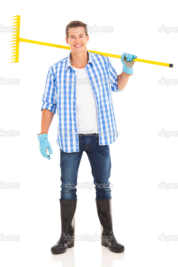 Man carrying a garden rake Stock Photo by ©michaeljung 46005253