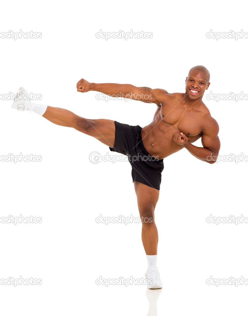 Active african muscular man kicking