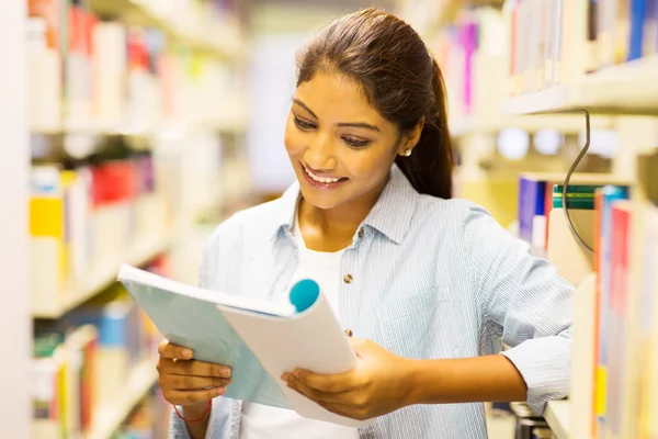 Female student reading book — Stock Photo, Image