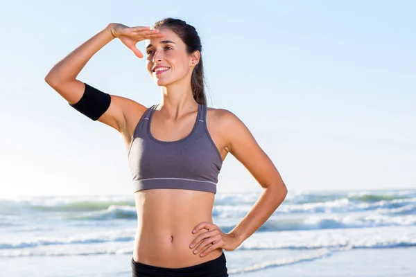 Sportive young woman on beach — Stock Photo, Image