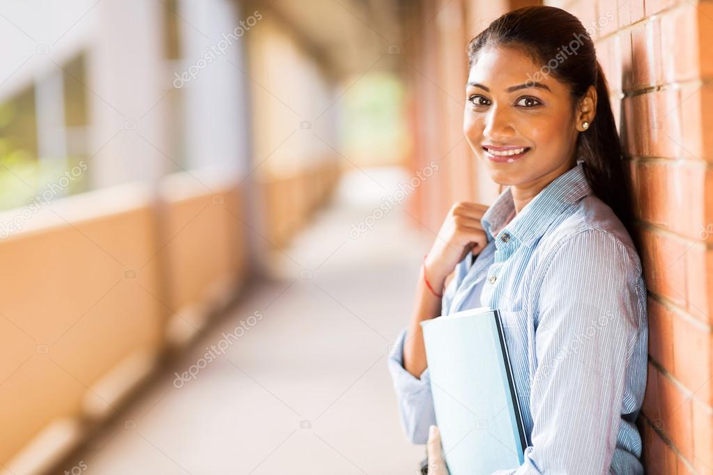 College student leaning against wall