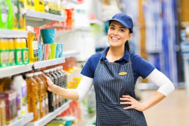 Saleswoman standing in store clipart