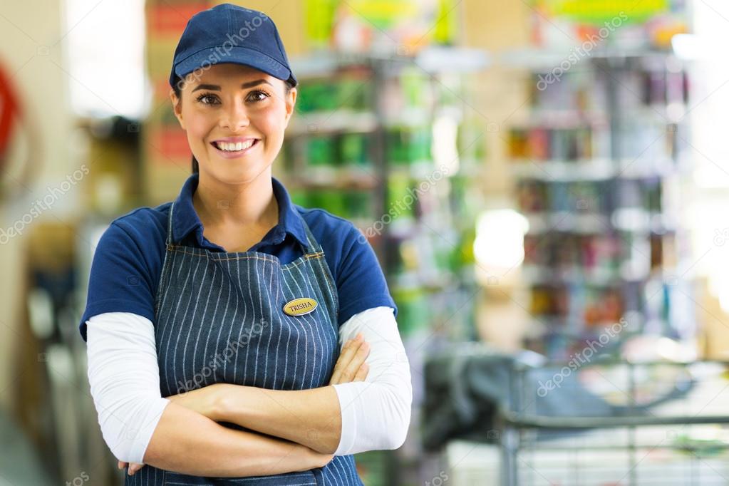 Store employee with crossed arms