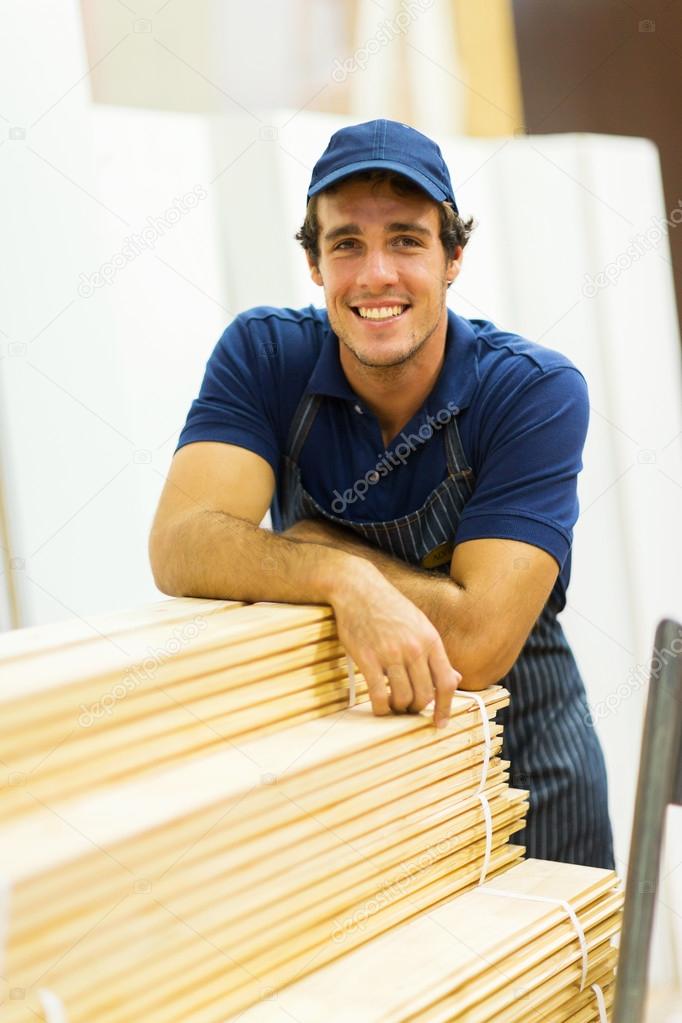 Worker leaned on stacked wood