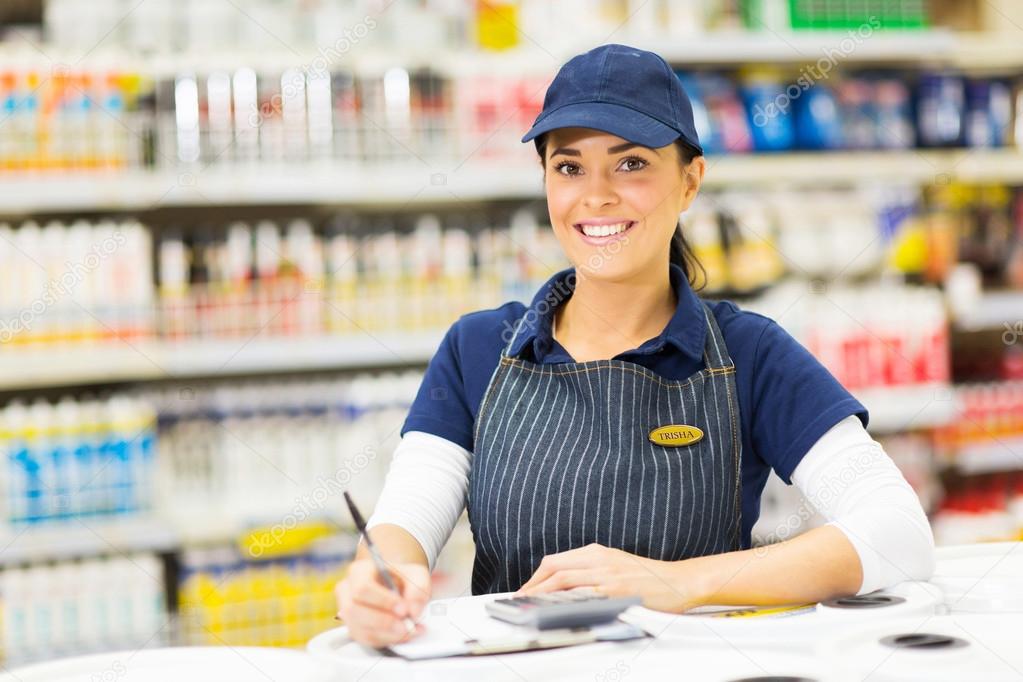 Hardware worker making notes