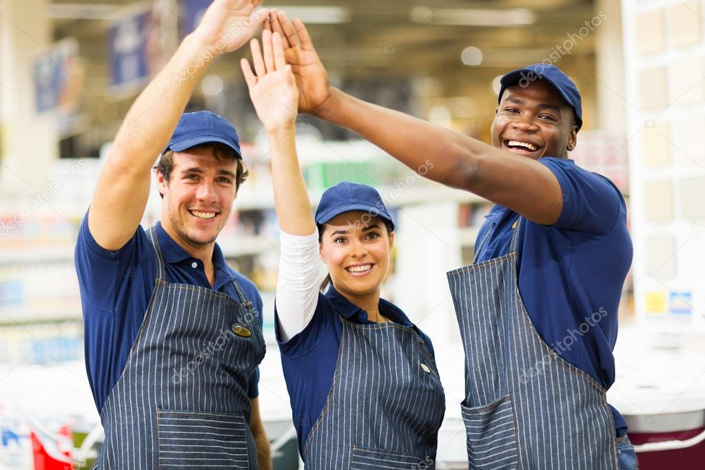 Store workers giving high five