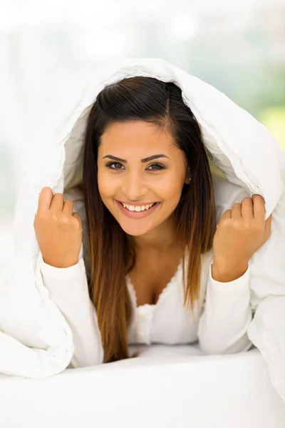 Woman lying under duvet — Stock Photo, Image