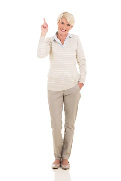 Mature woman pointing up — Stock Photo, Image
