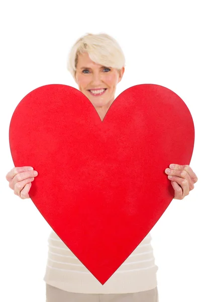 Žena prezentující tvaru srdce — Stock fotografie